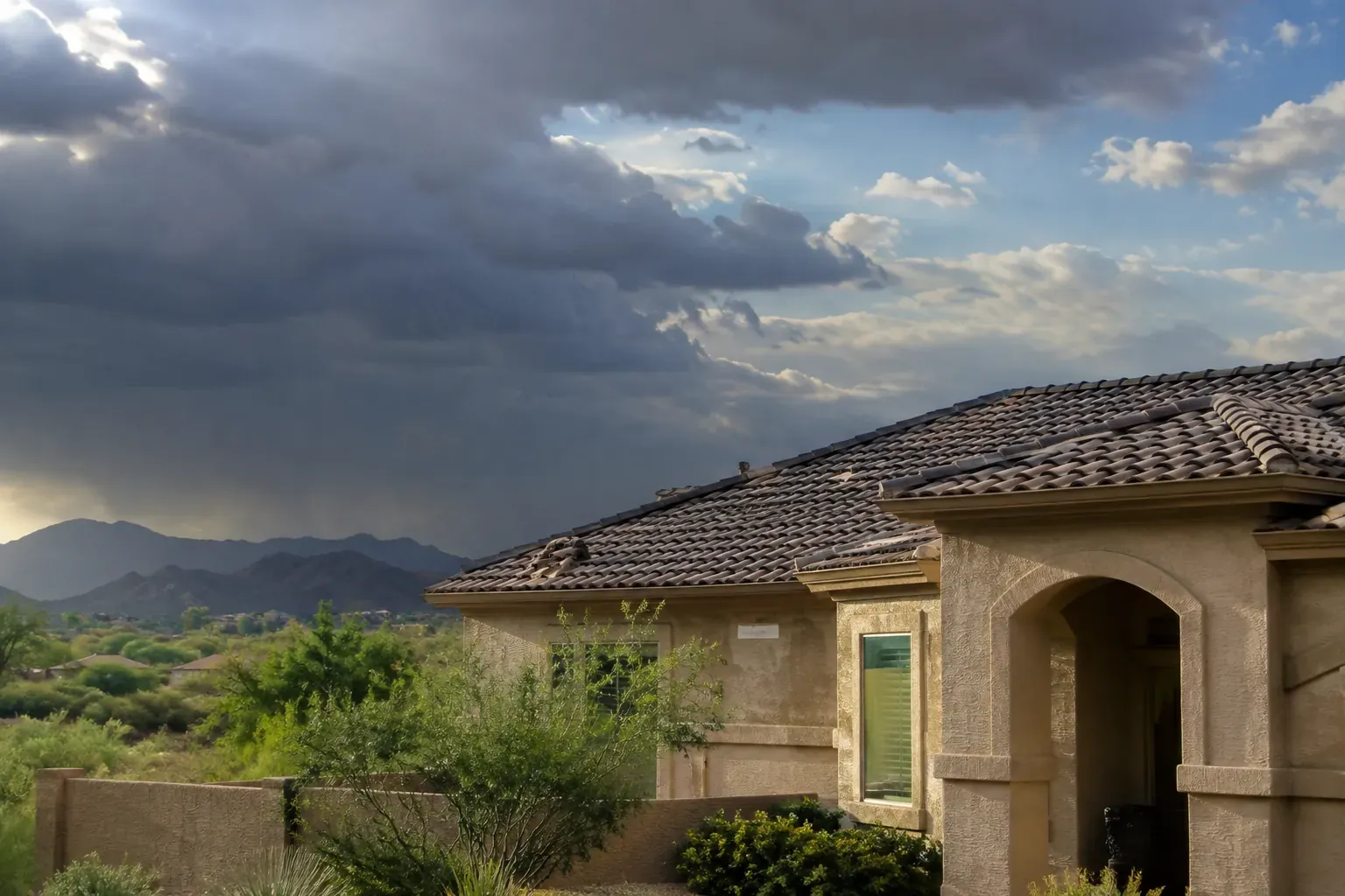 Arizona home roof with monsoon storm damage awaiting restoration